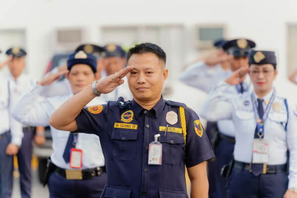 Security team performing formal salute during assembly for government relations and risk mitigation services in the Philippines – Gervasio Group of Companies
