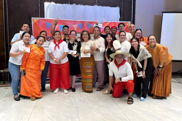 GGC staff dressed in festive costumes during the Christmas dinner celebration